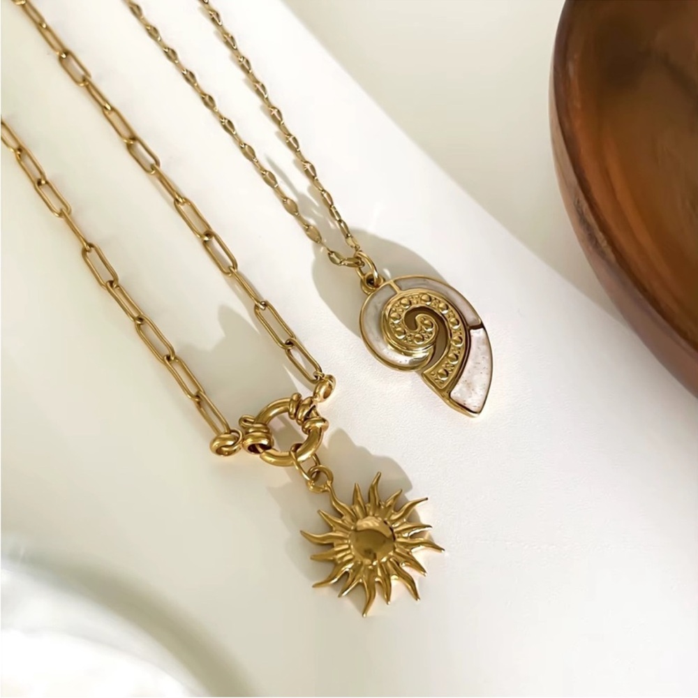 Gold Sun & White Shell Pendant Necklace

Stainless Steel Waterproof SET